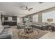 Expansive living room featuring a large sectional sofa, a glass-topped coffee table and an open layout at 1723 N Hillcrest --, Mesa, AZ 85201