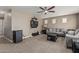 Comfortable living room featuring neutral tones and a ceiling fan for added comfort at 1723 N Hillcrest --, Mesa, AZ 85201