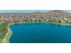 Beautiful neighborhood by the lake with lush green spaces, mature trees and mountain views at 18088 W San Alejandro Dr, Goodyear, AZ 85338