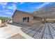 Spacious backyard with a large covered patio, desert landscaping, and room for outdoor activities at 18088 W San Alejandro Dr, Goodyear, AZ 85338