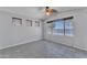 Bright bedroom with ceiling fan, and a large window with lake view at 18088 W San Alejandro Dr, Goodyear, AZ 85338