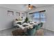 Elegant dining room with stylish furniture, lake views, and an inviting atmosphere for gatherings at 18088 W San Alejandro Dr, Goodyear, AZ 85338
