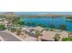 Gorgeous waterfront home with meticulous landscaping, a private pool, and breathtaking lake views at 18088 W San Alejandro Dr, Goodyear, AZ 85338