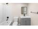 Bathroom featuring tub/shower combo, toilet, vanity, mirror, and chrome fixtures at 1911 E Lawrence Rd, Phoenix, AZ 85016