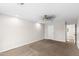 Spacious carpeted bedroom with neutral walls, recessed lighting, and a ceiling fan at 1911 E Lawrence Rd, Phoenix, AZ 85016