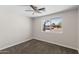 Bedroom features window, fresh paint, carpet and ceiling fan at 1911 E Lawrence Rd, Phoenix, AZ 85016