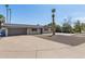Charming home boasts desert landscaping, complemented by palm trees and a basketball court at 1911 E Lawrence Rd, Phoenix, AZ 85016