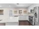 Well-appointed kitchen featuring stainless steel appliances, modern countertops, and ample cabinet space for storage at 1911 E Lawrence Rd, Phoenix, AZ 85016