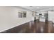 Bright and airy living area with hardwood floors, seamlessly connecting to the modern kitchen for easy entertaining at 1911 E Lawrence Rd, Phoenix, AZ 85016