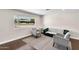 Bright living room features dark hardwood floors and stylish, neutral-toned furnishings at 1911 E Lawrence Rd, Phoenix, AZ 85016