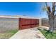 Backyard with block wall, concrete walk and mature tree at 1930 W Voltaire Ave, Phoenix, AZ 85029