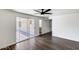 Bedroom features sliding glass doors to private outdoor area with brick patio and vinyl flooring at 1930 W Voltaire Ave, Phoenix, AZ 85029