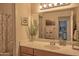 Well-lit bathroom with a neutral vanity, framed mirror and coordinated decor at 19777 N 76Th St # 2142, Scottsdale, AZ 85255
