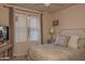 Cozy bedroom featuring a soft bed, natural light from the window, and elegant decor at 19777 N 76Th St # 2142, Scottsdale, AZ 85255