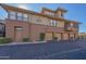 Multi-story building with private garages and well-maintained landscaping and exterior at 19777 N 76Th St # 2142, Scottsdale, AZ 85255