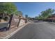 View of the Venu at Grayhawk community entrance with stone accents, beautiful landscaping, and clear signage at 19777 N 76Th St # 2142, Scottsdale, AZ 85255