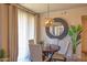 Cozy dining area featuring a round table, comfortable chairs, stylish lighting, and a welcoming ambiance at 19777 N 76Th St # 2142, Scottsdale, AZ 85255