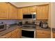 Modern kitchen featuring stainless steel appliances, granite countertops, and ample storage space for cooking convenience at 19777 N 76Th St # 2142, Scottsdale, AZ 85255