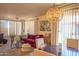 Living room with a red sofa, neutral decor, stylish lighting, and an inviting atmosphere for relaxing and entertaining at 19777 N 76Th St # 2142, Scottsdale, AZ 85255