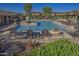 Lush community pool featuring ample lounge chairs and mature landscaping at 19777 N 76Th St # 2142, Scottsdale, AZ 85255