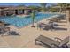 Beautiful community pool area with lounge chairs, umbrellas, and seating areas at 19777 N 76Th St # 2142, Scottsdale, AZ 85255