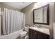 Bathroom features a shower-tub combo, vanity, and modern fixtures, offering comfort at 2006 W Gold Dust Ave, Queen Creek, AZ 85144
