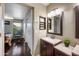 Bathroom featuring a vanity with a mirror, and bedroom access at 2006 W Gold Dust Ave, Queen Creek, AZ 85144