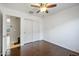 Bedroom features hardwood floor, ceiling fan, and closet, providing ample space at 2006 W Gold Dust Ave, Queen Creek, AZ 85144