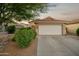 Charming single-story home with a two-car garage, desert landscaping, and a warm, inviting curb appeal at 2006 W Gold Dust Ave, Queen Creek, AZ 85144