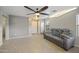 Spacious living room featuring tile floors, neutral paint, comfortable seating, and natural light at 2006 W Gold Dust Ave, Queen Creek, AZ 85144