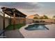Backyard pool with pergola-covered patio and desert landscaping for relaxing outdoor living at 2006 W Gold Dust Ave, Queen Creek, AZ 85144