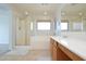 Bright bathroom with a soaking tub, walk-in shower, and a vanity with cabinets for ample storage at 20258 S 196Th St, Queen Creek, AZ 85142