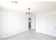 Bright bedroom with sliding closet doors and modern light fixture at 20258 S 196Th St, Queen Creek, AZ 85142