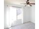 Bright bedroom featuring neutral paint, gray carpet and a ceiling fan for temperature control at 20258 S 196Th St, Queen Creek, AZ 85142