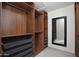 Organized walk-in closet featuring custom wood shelving, drawers, and ample storage space with a mirror on the wall at 20258 S 196Th St, Queen Creek, AZ 85142