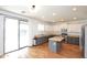 Modern kitchen with stainless steel appliances, granite countertops, and a central island for food prep and casual dining at 20258 S 196Th St, Queen Creek, AZ 85142
