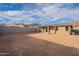 Expansive backyard space with block wall, perfect for outdoor entertaining and creating your dream desert oasis at 21411 W Meadowbrook Ave, Buckeye, AZ 85396