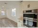 Modern kitchen features stainless steel LG appliances and ample counter space at 21411 W Meadowbrook Ave, Buckeye, AZ 85396
