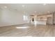 Unfurnished living space with wood-look tile flooring and an open floorplan at 21411 W Meadowbrook Ave, Buckeye, AZ 85396