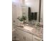 Bathroom featuring vanity sink with granite countertop, modern fixtures, and tiled shower and tub at 25109 N 173Rd Dr, Surprise, AZ 85387