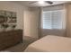 Cozy bedroom with dresser, light walls, and neutral carpet offers a peaceful retreat at 25109 N 173Rd Dr, Surprise, AZ 85387
