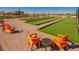 Enjoy the community bocce ball court with a seating area and overhead string lights for year-round fun at 25109 N 173Rd Dr, Surprise, AZ 85387