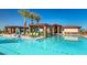 Resort-style community pool with lounge chairs, cabanas, and stunning architectural features for relaxation at 25109 N 173Rd Dr, Surprise, AZ 85387