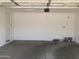 Clean, empty garage with ample space for parking and storage at 25109 N 173Rd Dr, Surprise, AZ 85387