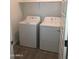 Functional laundry room with a washer and dryer, ready for convenient laundry tasks at 25109 N 173Rd Dr, Surprise, AZ 85387