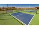 Vibrant blue and green pickleball courts offer hours of recreational enjoyment and a great workout at 25109 N 173Rd Dr, Surprise, AZ 85387