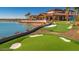 Scenic putting green featuring lush landscaping and an adjacent community clubhouse, a golfer's dream at 25109 N 173Rd Dr, Surprise, AZ 85387
