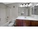 This full bathroom features a shower-tub combo, updated vanity, and large mirror at 280 S Evergreen Rd # 1296, Tempe, AZ 85288