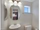 Bathroom featuring a sink, toilet and a view of the kitchen at 280 S Evergreen Rd # 1296, Tempe, AZ 85288