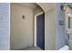 Inviting front door with a textured wall and overhead lamp at 280 S Evergreen Rd # 1296, Tempe, AZ 85288